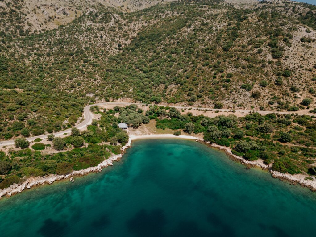 An aerial photo of Palouria Beach, one of the best Paleros beaches