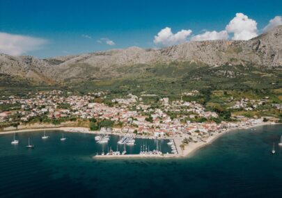 A panoramic photo of Paleros and its port. The image serves as a cover photo for an article about the best things to do in Paleros, written for the Estia Ionian Villas blog.