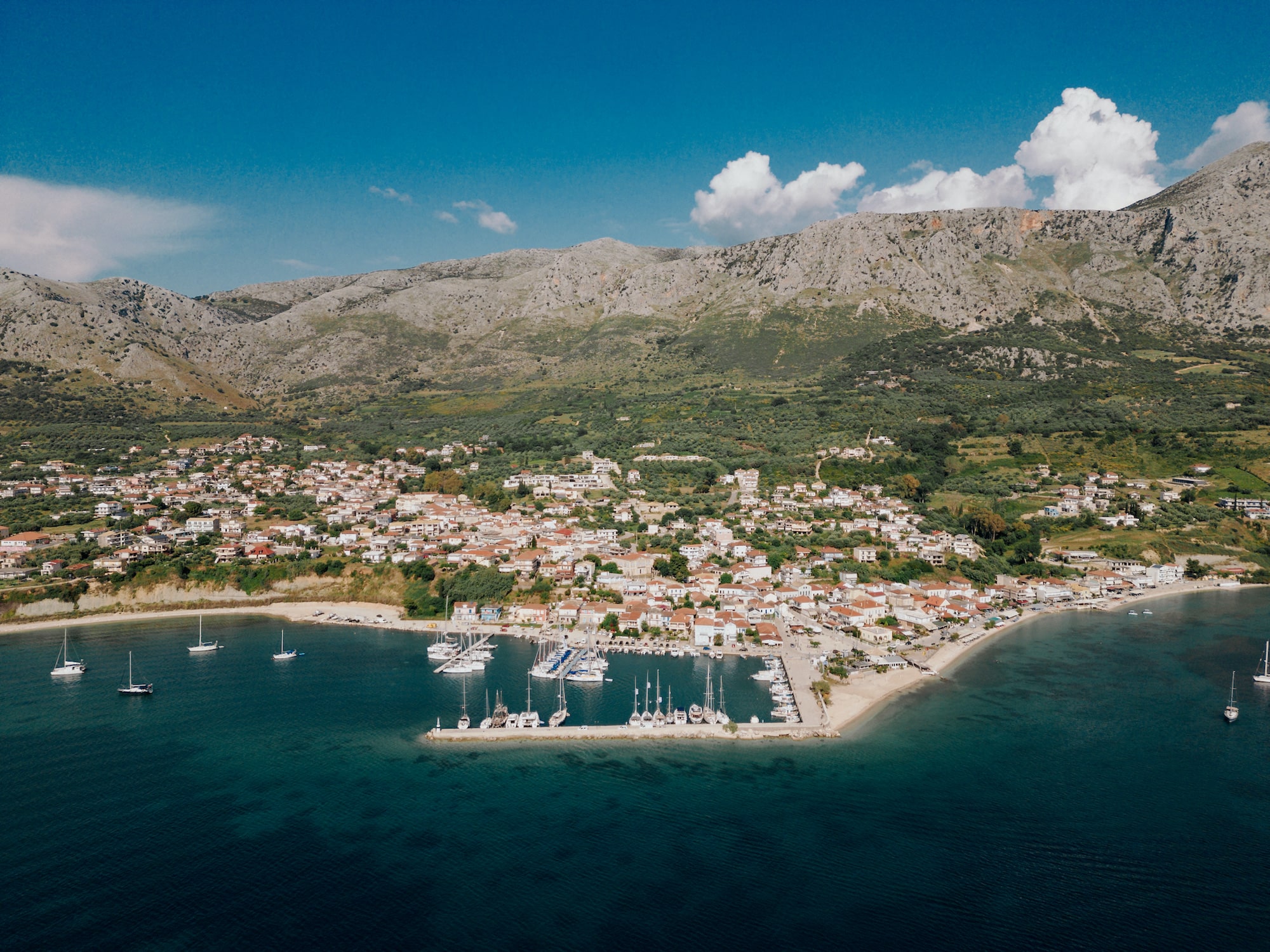 A panoramic photo of Paleros and its port. The image serves as a cover photo for an article about the best things to do in Paleros, written for the Estia Ionian Villas blog.