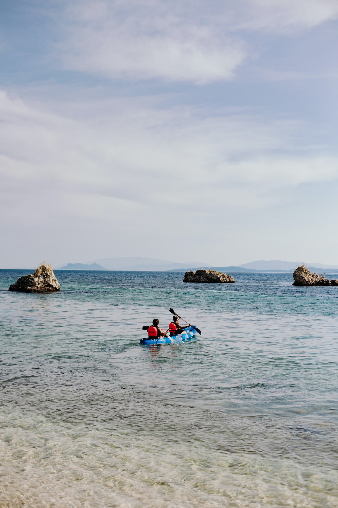 Two people on a kayak tour. Watersports is one of the best things to do in Paleros, Greece
